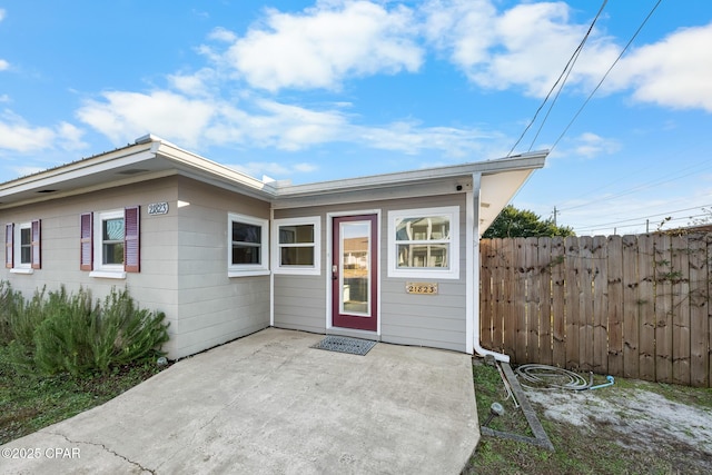 21823 Marlin Ave, Panama City Beach, FL 32413 - doorway to property featuring a patio