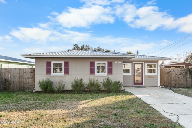 ranch-style home with a front lawn