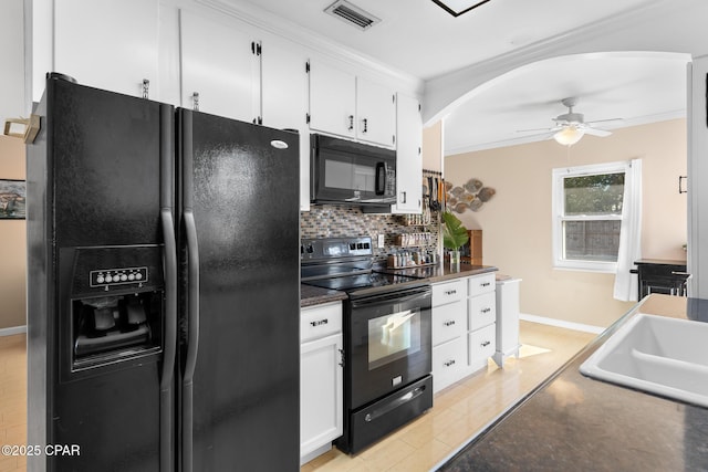 kitchen with white cabinetry, decorative backsplash, black appliances, and crown molding