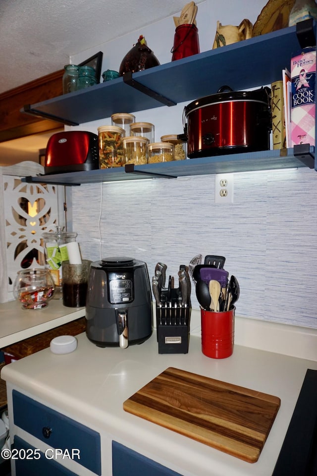 interior space with blue cabinetry