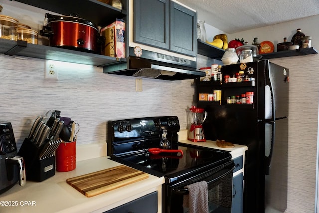 kitchen with black appliances and a textured ceiling