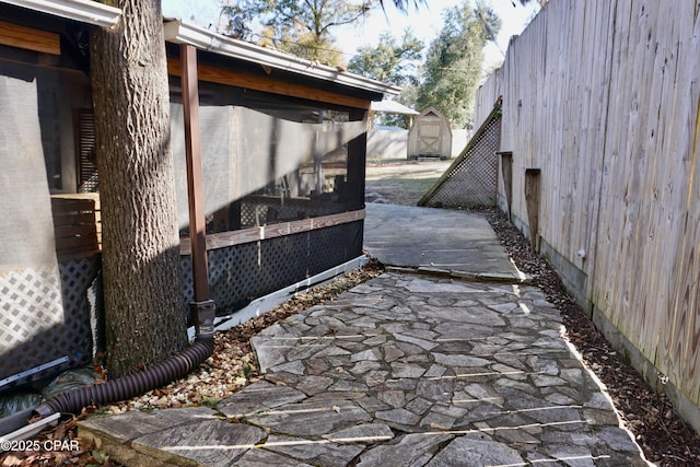 exterior space with a shed