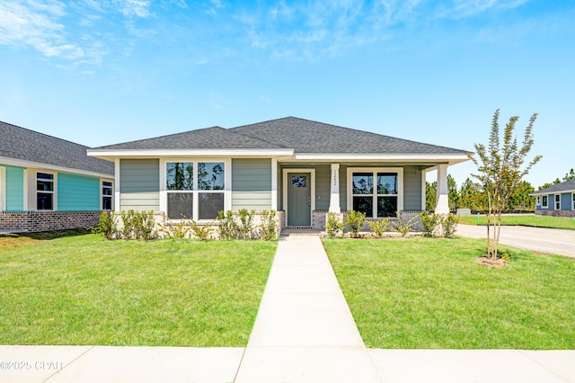 1202 Danley St, Panama City, FL 32404 - prairie-style home with a shingled roof, covered porch, and a front yard