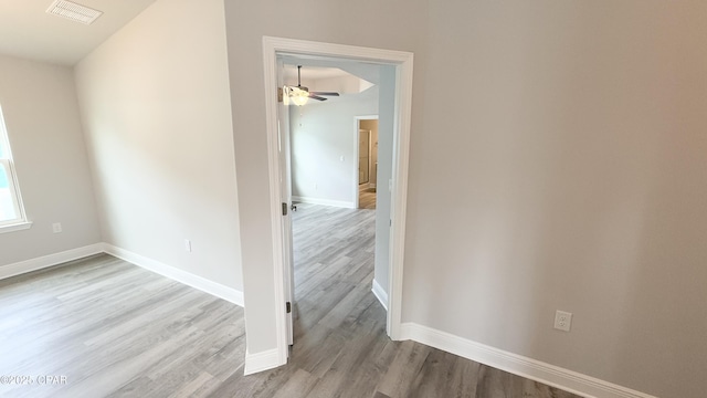 spare room featuring ceiling fan and light hardwood / wood-style floors