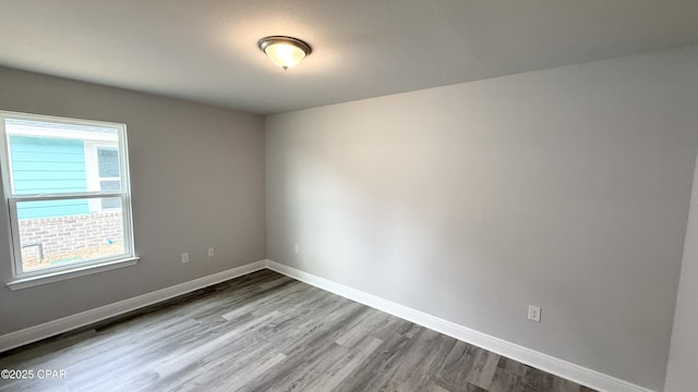 spare room featuring light hardwood / wood-style floors