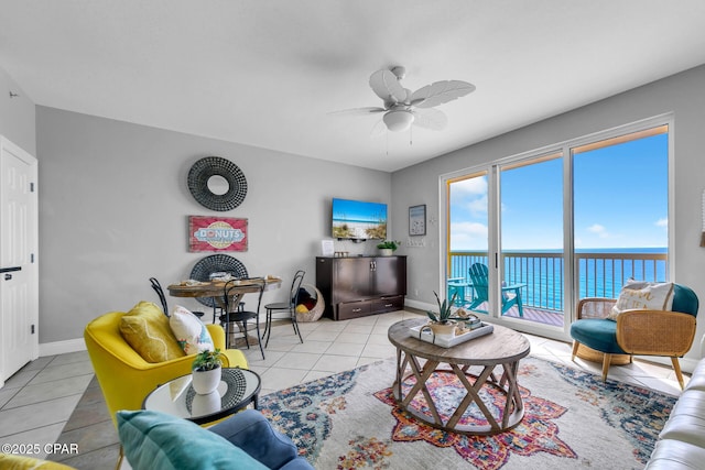 tiled living room with ceiling fan