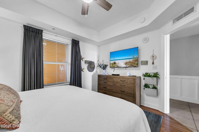 bedroom with dark wood-type flooring and ceiling fan