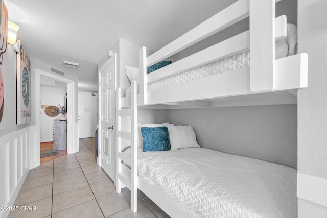 bedroom featuring light tile patterned flooring