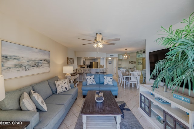 tiled living room featuring ceiling fan