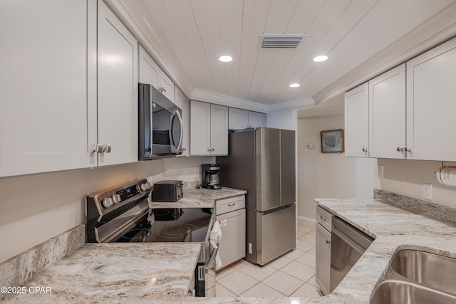 kitchen featuring white cabinets, wood ceiling, stainless steel appliances, crown molding, and light stone countertops