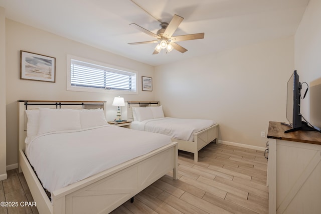 bedroom featuring light hardwood / wood-style flooring and ceiling fan