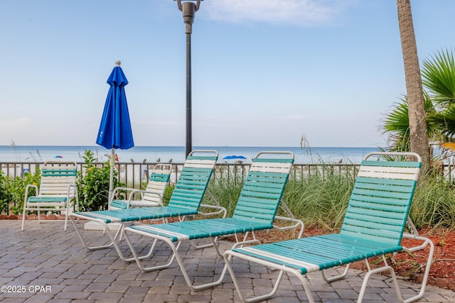 view of patio featuring a water view