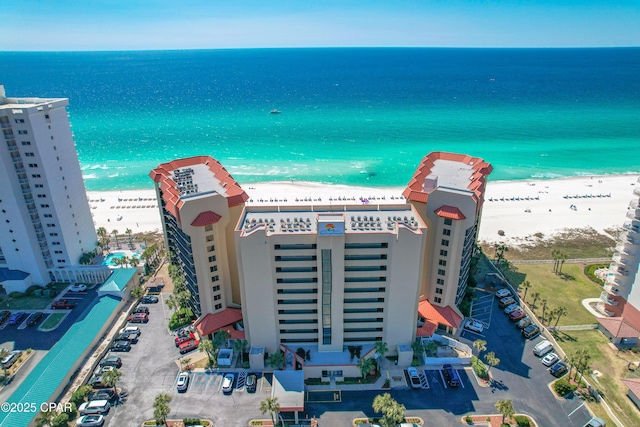 bird's eye view with a view of the beach and a water view