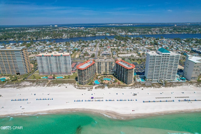 bird's eye view featuring a water view and a beach view