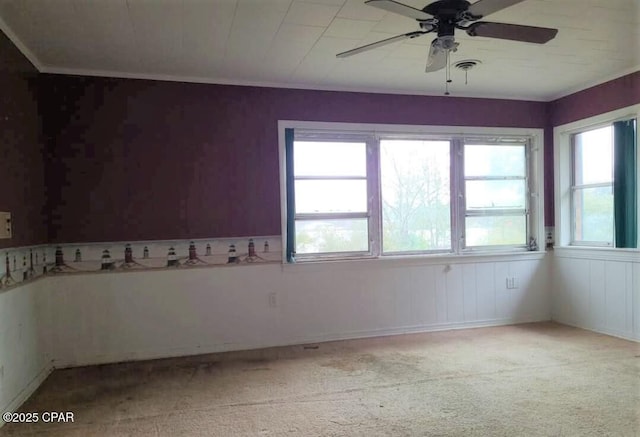 unfurnished room with ceiling fan and light colored carpet