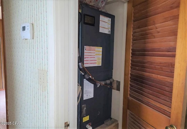 utility room with heating unit