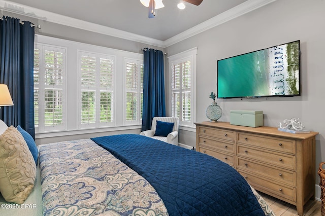 22207 Fox Glenn Trce, Panama City Beach, FL 32413 - bedroom with crown molding, light wood-style flooring, and a ceiling fan
