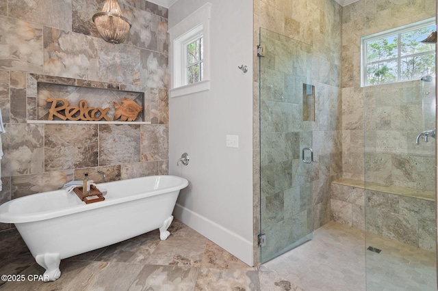22207 Fox Glenn Trce, Panama City Beach, FL 32413 - bathroom with a shower stall, a freestanding tub, and baseboards
