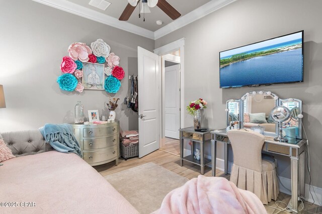 22207 Fox Glenn Trce, Panama City Beach, FL 32413 - bedroom with ornamental molding, wood finished floors, and a ceiling fan