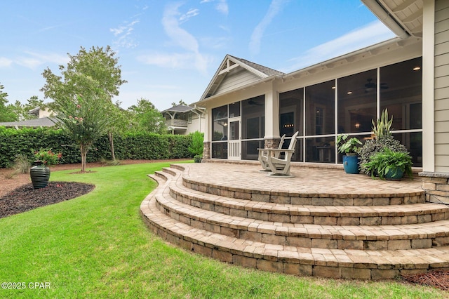 22207 Fox Glenn Trce, Panama City Beach, FL 32413 - rear view of property with a sunroom, a patio area, a lawn, and ceiling fan