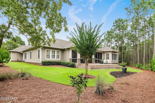 22207 Fox Glenn Trce, Panama City Beach, FL 32413 - view of front facade featuring a sunroom and a front lawn