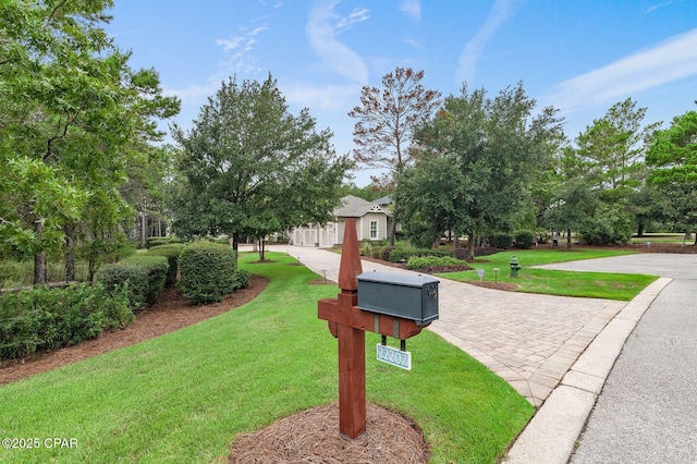 22207 Fox Glenn Trce, Panama City Beach, FL 32413 - view of property's community featuring a yard and driveway