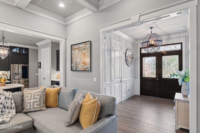 22207 Fox Glenn Trce, Panama City Beach, FL 32413 - foyer entrance with a chandelier, ornamental molding, wood finished floors, beamed ceiling, and french doors