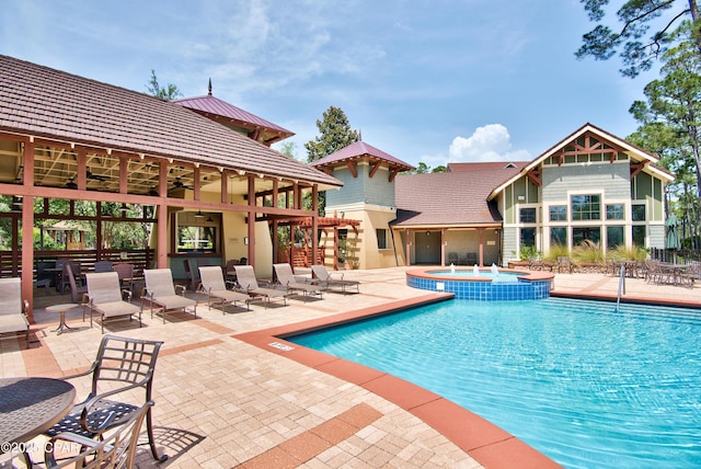 22207 Fox Glenn Trce, Panama City Beach, FL 32413 - view of pool featuring a pool with connected hot tub, a ceiling fan, and a patio area