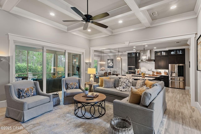22207 Fox Glenn Trce, Panama City Beach, FL 32413 - living room with coffered ceiling, ceiling fan, beam ceiling, light wood-style floors, and crown molding