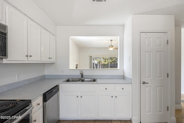 kitchen with white cabinetry, ceiling fan, stainless steel appliances, and sink