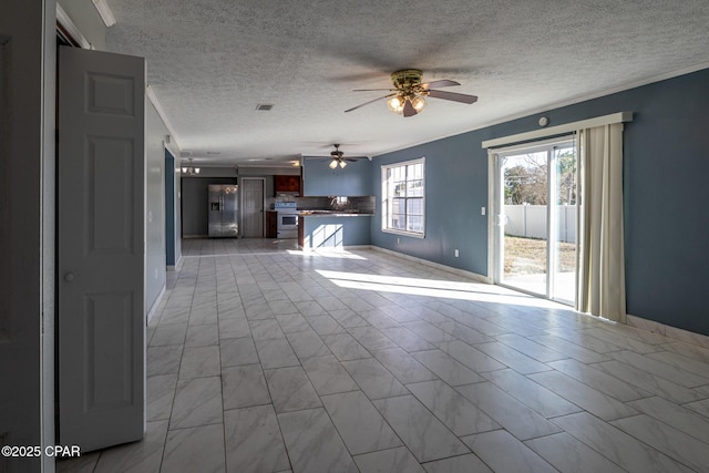unfurnished living room with visible vents, baseboards, a ceiling fan, and crown molding