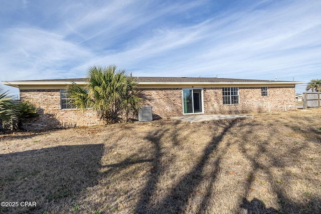 back of property featuring a yard and a patio area