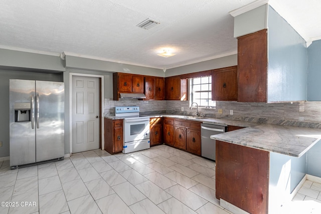 kitchen featuring sink, crown molding, backsplash, stainless steel appliances, and kitchen peninsula