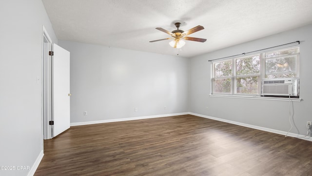 unfurnished room featuring ceiling fan, dark hardwood / wood-style floors, and a textured ceiling