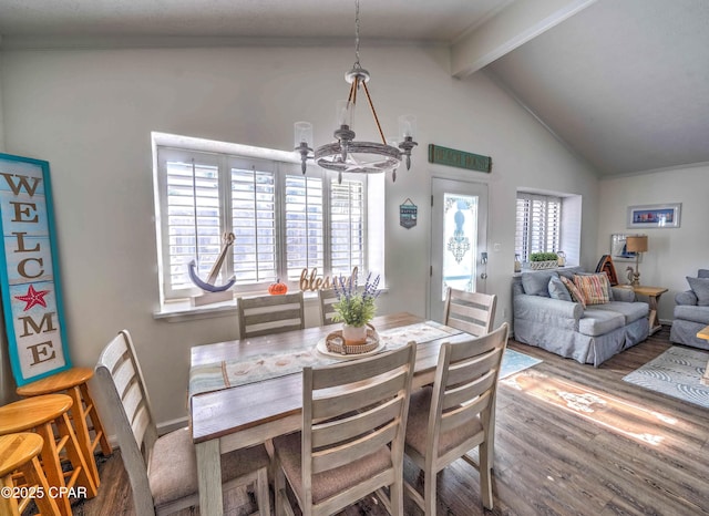 dining space featuring vaulted ceiling with beams, hardwood / wood-style flooring, and a chandelier