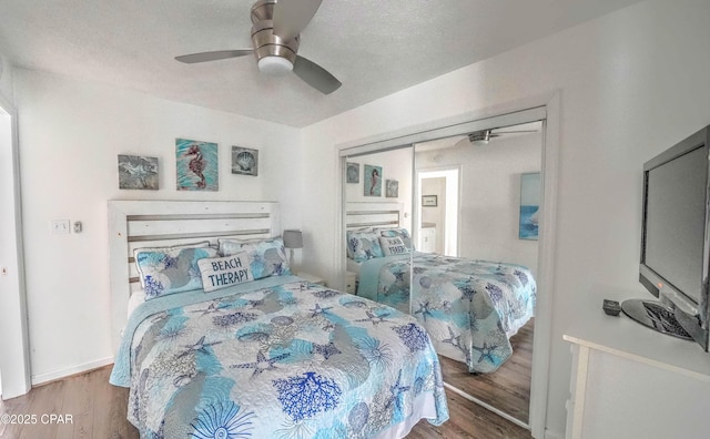 bedroom featuring wood-type flooring and ceiling fan