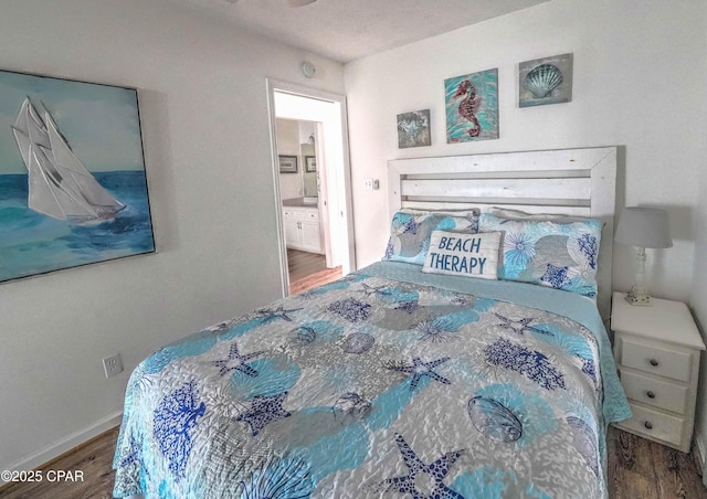 bedroom with wood-type flooring and ensuite bathroom