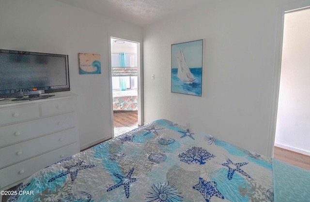 bedroom featuring hardwood / wood-style floors