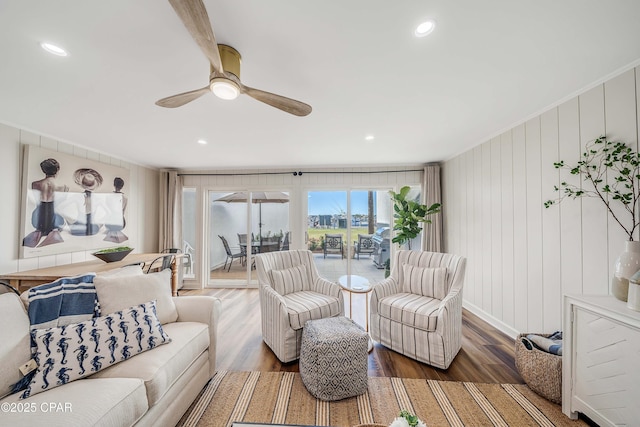 living room with hardwood / wood-style flooring and ceiling fan