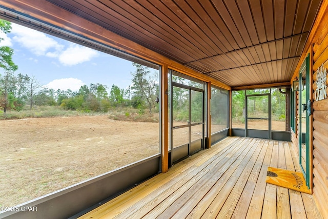 unfurnished sunroom with wood ceiling