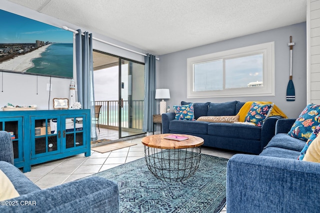 5801 Thomas Dr Unit 601, Panama City Beach, FL 32408 - living room with tile patterned flooring and a textured ceiling
