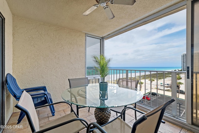 5801 Thomas Dr Unit 601, Panama City Beach, FL 32408 - balcony featuring a beach view, a ceiling fan, a sunroom, and a water view