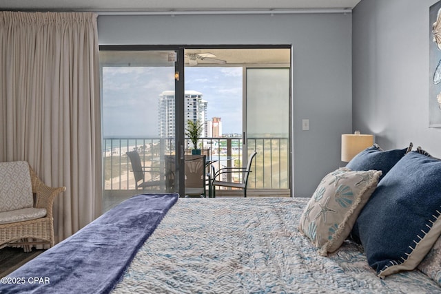 5801 Thomas Dr Unit 601, Panama City Beach, FL 32408 - bedroom featuring access to outside and multiple windows