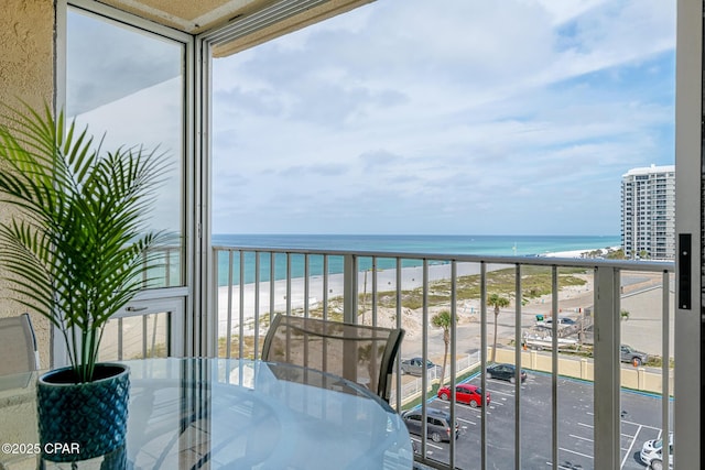 5801 Thomas Dr Unit 601, Panama City Beach, FL 32408 - balcony with a beach view, outdoor dining area, and a water view