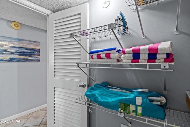 5801 Thomas Dr Unit 601, Panama City Beach, FL 32408 - interior space with a textured ceiling, tile patterned flooring, and baseboards