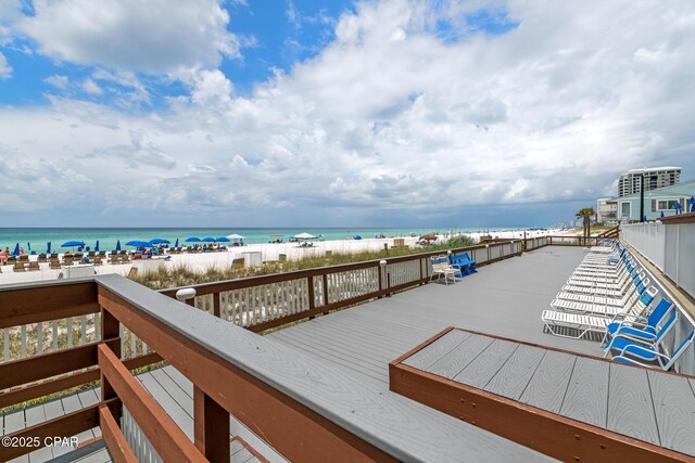 5801 Thomas Dr Unit 601, Panama City Beach, FL 32408 - wooden deck with a beach view and a water view