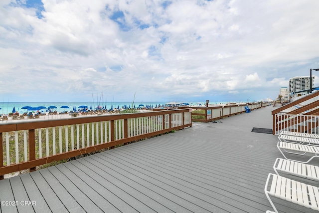 5801 Thomas Dr Unit 601, Panama City Beach, FL 32408 - wooden terrace featuring a water view