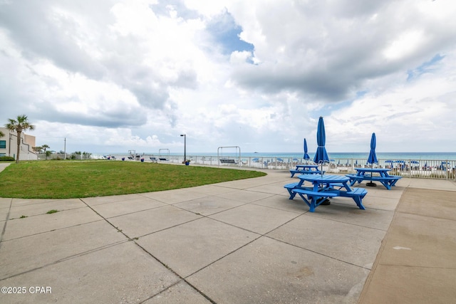 5801 Thomas Dr Unit 601, Panama City Beach, FL 32408 - view of patio / terrace with a water view