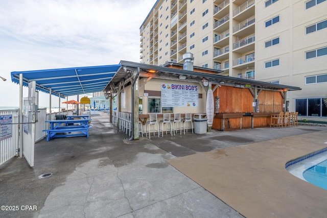 5801 Thomas Dr Unit 601, Panama City Beach, FL 32408 - view of building exterior featuring a carport