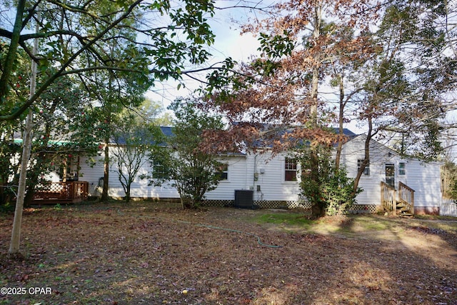 view of side of home featuring entry steps and central AC